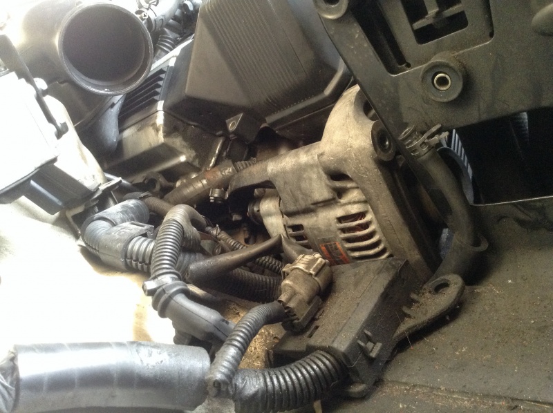 File:Unbolted cable bracket under air box.jpg